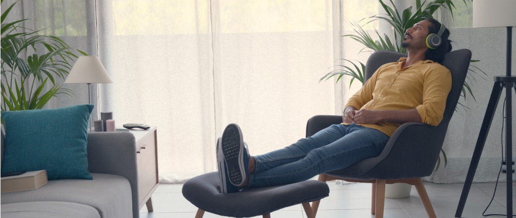 Man relaxing with headphones - no worries
